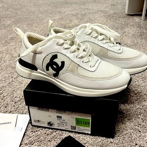 Non authentic Chanel sneakers size 40 never worn. Comes with box
